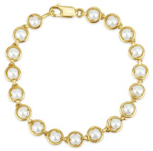 White fresh water pearl bracelet with 10k yellow gold surrounding the pearls