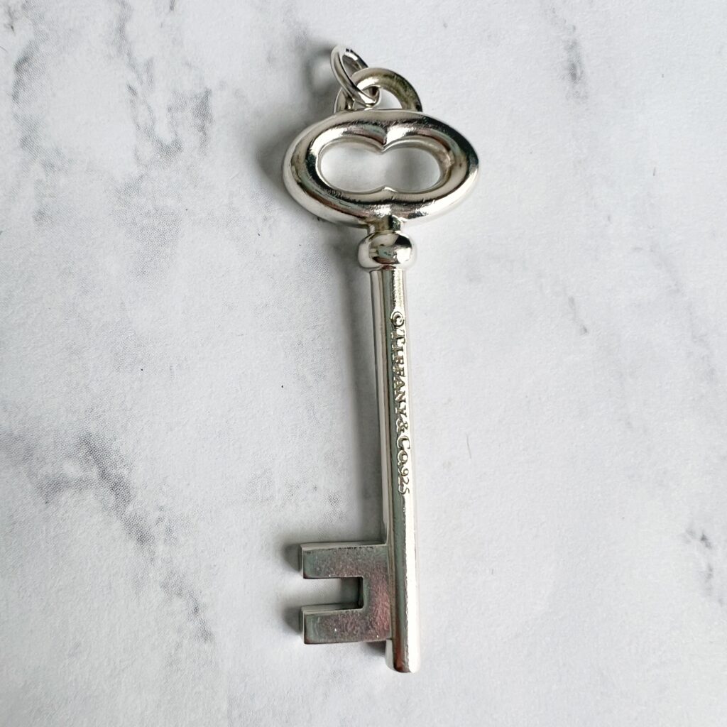 PD00662 Tiffany & co sterling silver key charm pendant logo