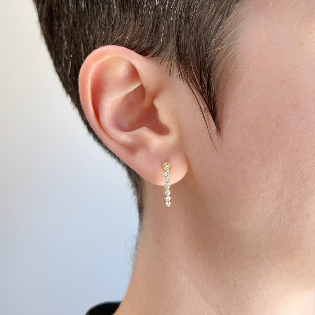 yellow gold diamond shared prong diamond hoop earrings model